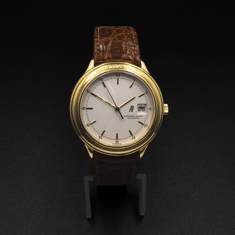 Audemars Piguet Huitième yellow-gold watch with light dial and brown crocodile leather strap