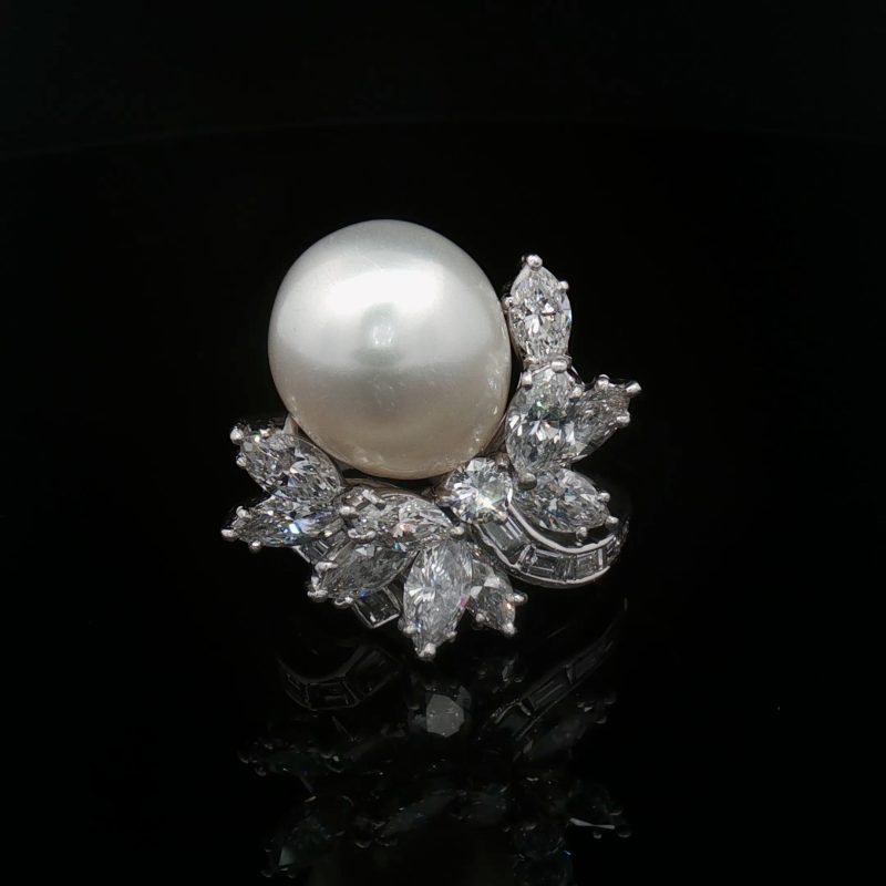 French vintage platinum ring from the 1960s–1970s featuring a large cultured pearl and 3.46 ct of diamonds in marquise, baguette and brilliant cuts.